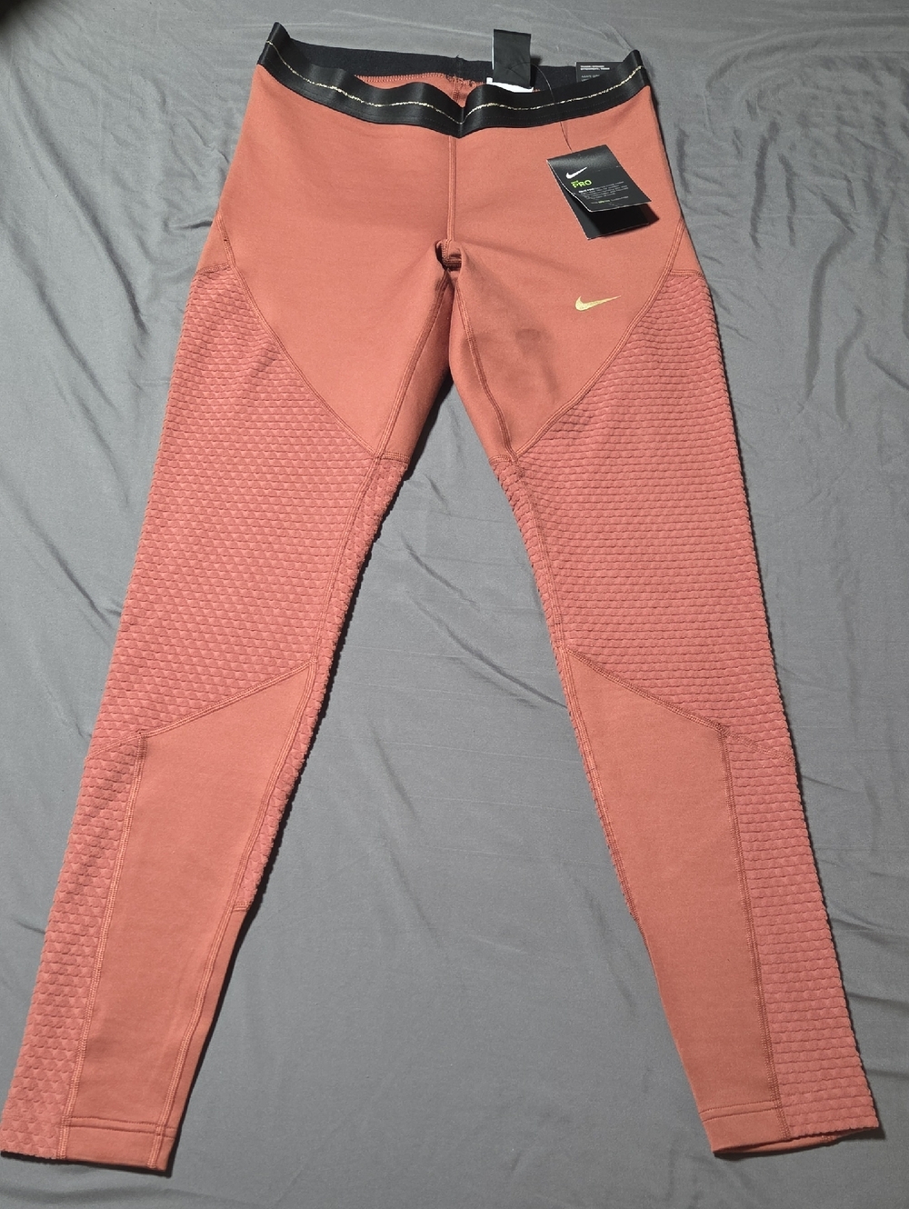 Nike Rust Salmon Leggings with Gold Swoosh